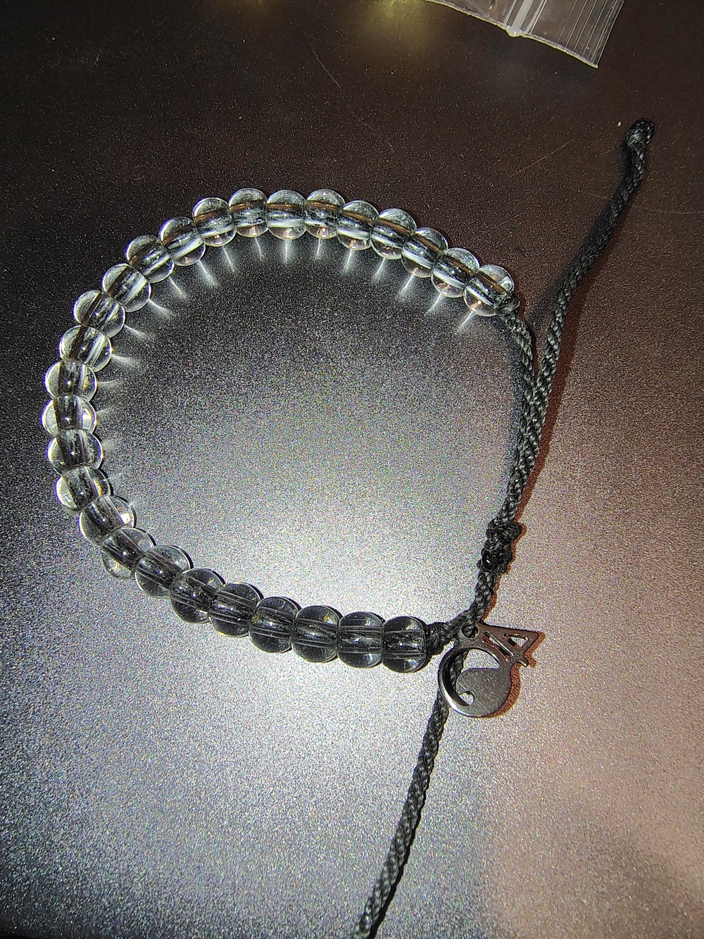 4Ocean Clear Glass Bead Adjustable Bracelet Wave Charm Black Cord Unisex